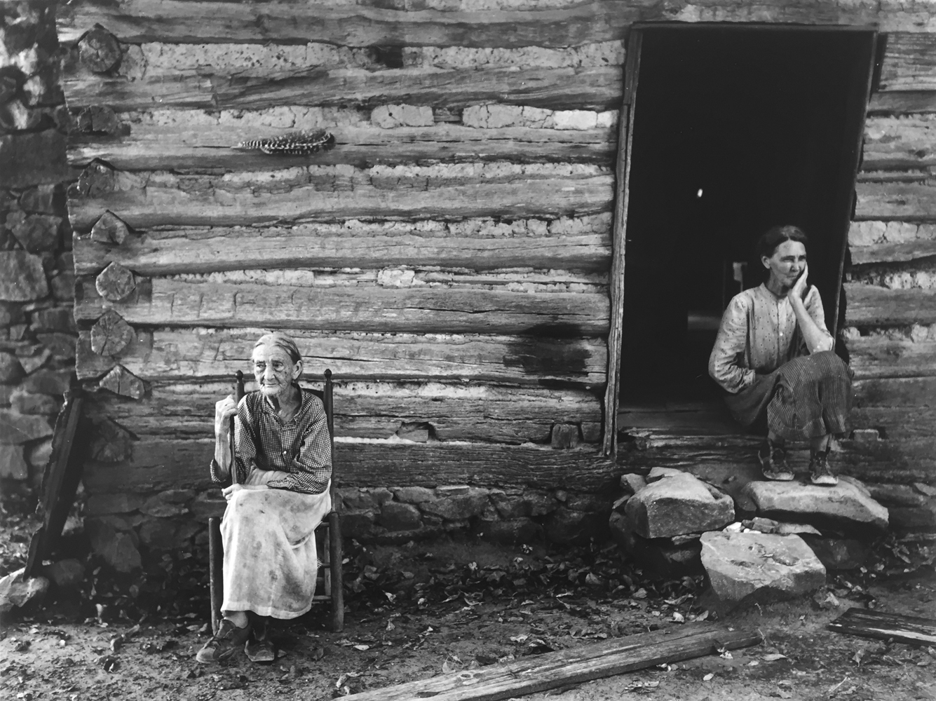 Marion Post Wolcott, Mrs, Lloyd, ninety-one years old, and daughter with pellagra, in doorway of old log house. Near Carboro, North Carolina, 1929, gelatin silver print, 11 x 14 inches, price on request