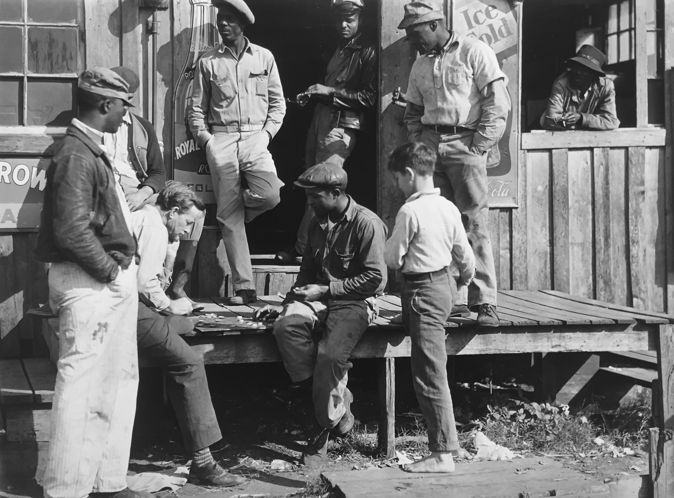 Marion Post Wolcott, Migrants playing checkers (with bottle caps), on a juke joint porch after a “freeze-out” of vegetable crops. Near Okeechobee, Florida, 1939, gelatin silver print, 11 x 14 inches, signed by artist, $3000.