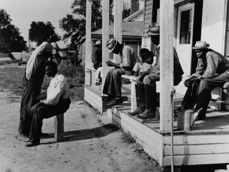 Marion Post Wolcott, Haircutting in front of general store, Marcella Plantation, Mileston, Mississippi, 1939 gelatin silver print, 11 x 14 inches, signed by artist, $3000.