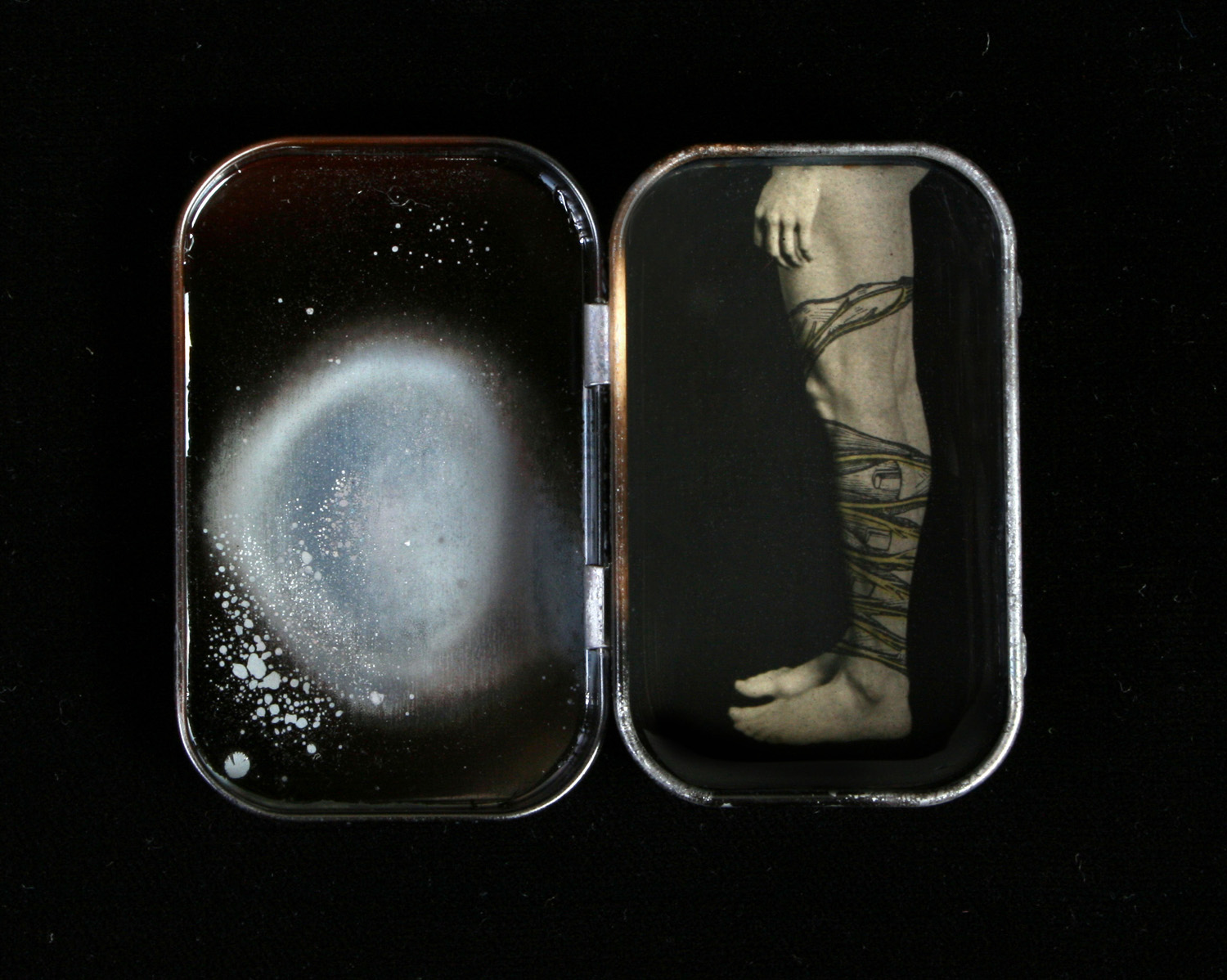 Heidi Kirkpatrick, Untitled (small tin), 2008, tin, photolith film, resin, 2.25 x 3 x .5 inches, $275.